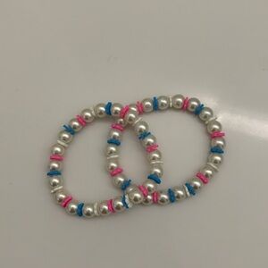 Two pink and blue flower pearls